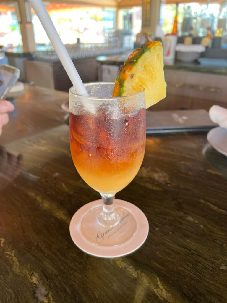 mai tai with pineapple wedge on glass rim